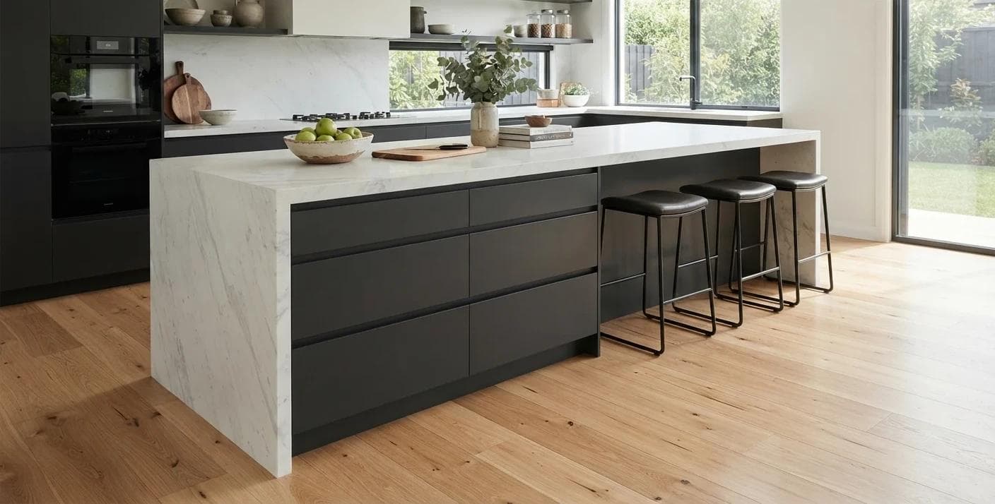 Herringbone engineered timber laid through a naturally lit waterfront gallery space.